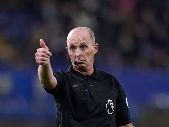 Mike Dean refereeing in the Premier League.