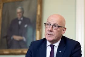 John Swinney speaks to journalists