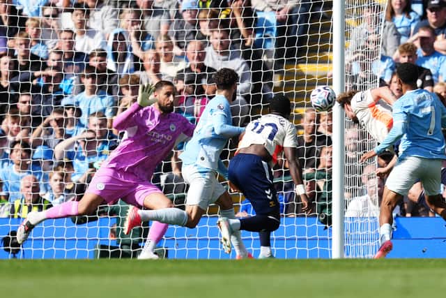 Manchester City goalkeeper Gianluigi Donnarumma makes a crucial save against Coventry (Martin Rickett/PA)