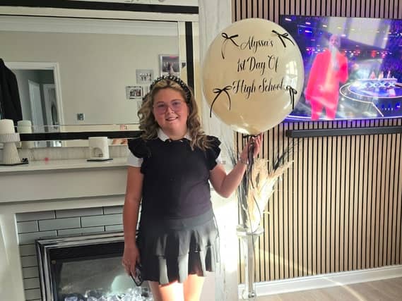 Alyssa holding a balloon