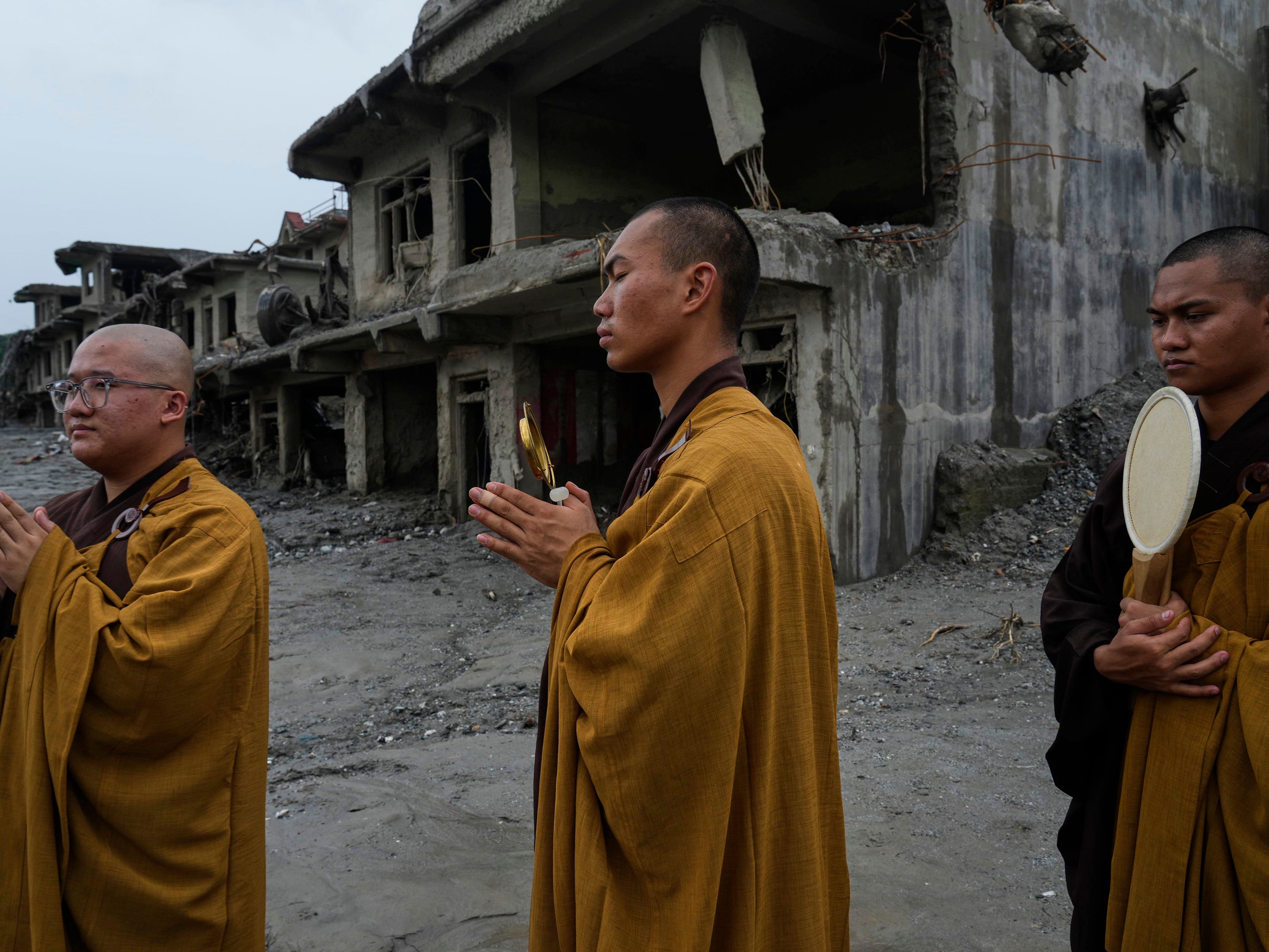 Buddhist monks offer prayers for the departed