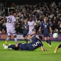 Joe Willock, left, scores