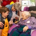 Ms Maureen Finn chatting with Neighbour Jessie Collins and her grandson Ben on the occasion of her 100th Birthday party in Riada House, Tullamore.