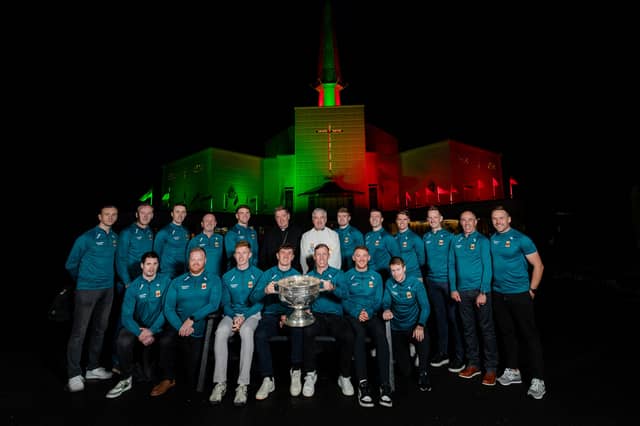 Fr Richard Gibbons and Archbishop Francis Duffy with members of the Mayo All-Ireland team and backroom members after a special thanksgiving prayer service at Knock Shrine yesterday evening.