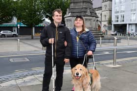 Ukrainian refugees Pavlo Romaniuk, 31, and Yuliia Nahaiets, 30, with their faithful guide dog Amigo. They are desperately hoping to remain in Limerick, but face an uphill battle | PICTURES: Adrian Butler