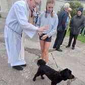 Fr Pat blessing pets last year