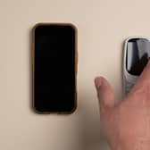A hand on a phone