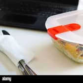 Lunch with pasta in Tupperware at the office desk