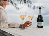 Woman enjoying a glass of French Bloom Extra Brut Alcohol Free Sparkling Wine