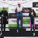 Róisín on the Mondello Podium with champion race drivers Richie Kearney, left and Enda O'Connor, centre