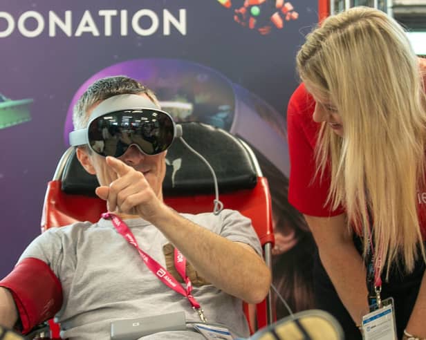 Journalist Trevor Quinn testing the new headset alongside Nuala Haughian