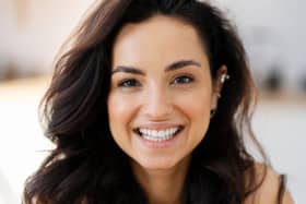 A woman smiling