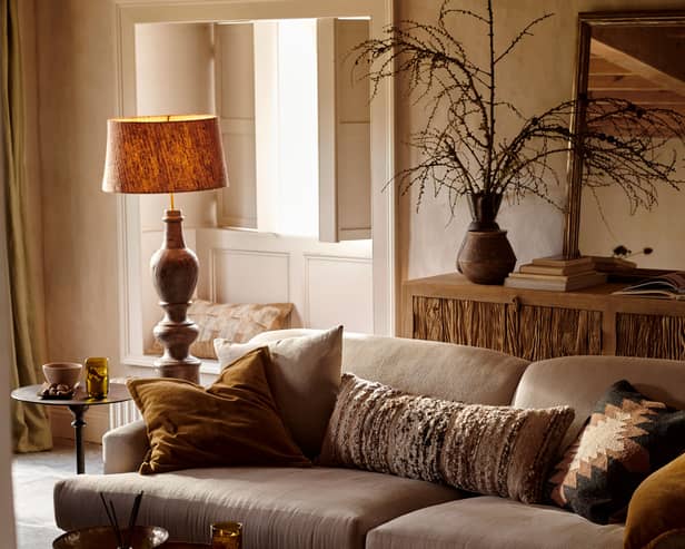Naya Carved Wood Floor Lamp Base – Chocolate Brown; Nadee Banana Lea Lampshade – Natural; Yamuna Rectangular Mirror – Aged Antique Brass; Mua Statement Boucle Lumbar Cushion Cover - Mocha, rest of items from a selection, Nkuku