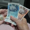 A woman holding cash