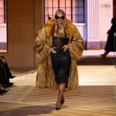 Rosie Huntington-Whiteley showcasing the return of pencil skirts on the Gucci runway
