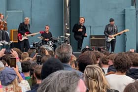 U2 during a performance in front of students from their old school in Dublin