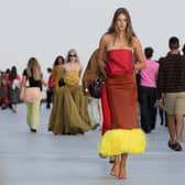 A model wears a creation part of the Moschino women’s Spring-Summer 2027 collection, presented in Milan, Italy, Friday, Sept. 25, 2026. (AP Photo/Luca Bruno)