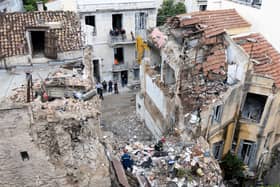 Firefighters at the scene of the collapsed house in Athens