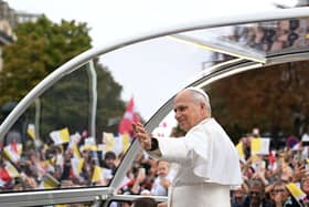 The Pope waves to crowds in Paris