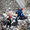 Firefighters work at the scene