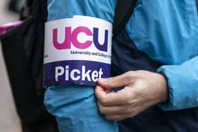 A UCU member wears a picket badge