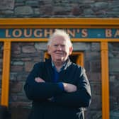 Josie McLoughlin outside McLoughlin's Bar in Achill