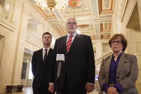 (left to right), DUP MLA Jonathan Buckley, party leader Gavin Robinson MP, speaking with media, and DUP MLA Diane Dodds in the Great Hall at Parliament Buildings, Stormont, after a plenary sitting of the Northern Ireland Assembly following a day-long stand-off over the Drumcree parade