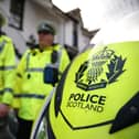 Police Scotland officers and motorbike