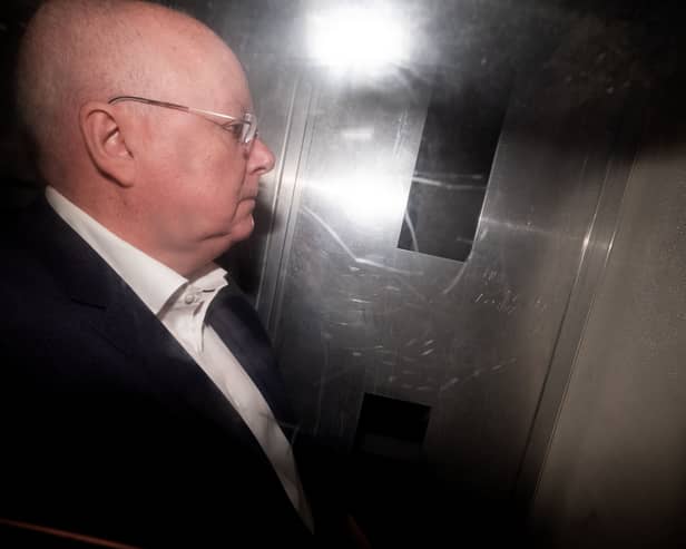 Peter Murrell in the back of a prison van