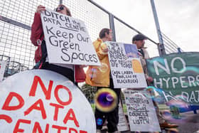 Protesters holding up placards reading 'No data centre' and 'Keep our green spaces'