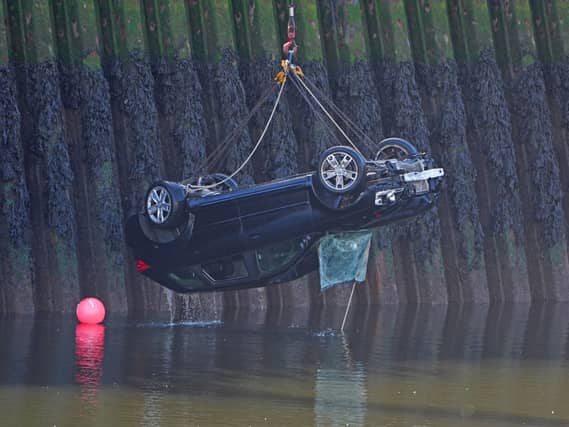 A car is removed from the River Wear in Sunderland, after three teenagers died when a car entered the water
