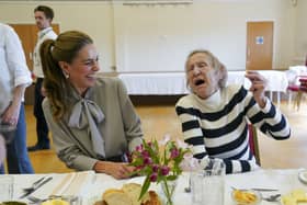 The Princess of Wales laughs with Lynda Jones, 74, during a visit to the West Sussex Minibus Service, a volunteer-led community transport organisation