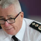 Headshot of Jon Boutcher speaking, in uniform