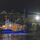 A group of people thought to be migrants are brought in to a marina in Gosport, by the RNLI following a small boat incident in the Channel