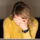 A woman looking stressed