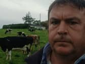 Farmer Michael O'Dwyer from Doora, Co Clare with cows in the background