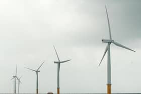 View of wind turbines at sea