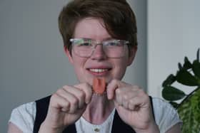 Dr Imogen Brooks, who is believed to be the first person in the UK to get a bespoke artificial tongue, poses for a portrait with her spare artificial tongue