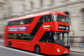 General view of a red London bus, in central London