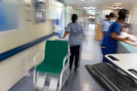 Blurred image of busy hospital corridor