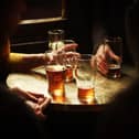 Pint glasses on a table in a pub