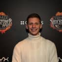 Freddy Brazier smiling at a premiere