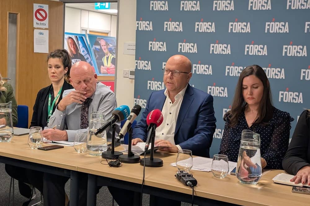 Fórsa general secretary Kevin Callinan (centre) speaking at the union's headquarters in Dublin