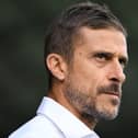 Watford manager Alessio Dionisi chews his lip on the touchline