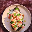 BAKED AUBERGINE with WHIPPED FETA, PICKLED RADISH and CHICKPEAS. GATHERING by Monica Galetti. Image credit Yuki Sugiura