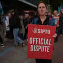 Sinead McCarville, senior housekeeper in the high dependency unit at the Mater Hospital, Dublin, takes part in a 24-hour strike outside the hospital over delays in agreeing a new public sector pay deal