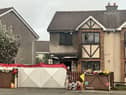 Floral tributes outside the house