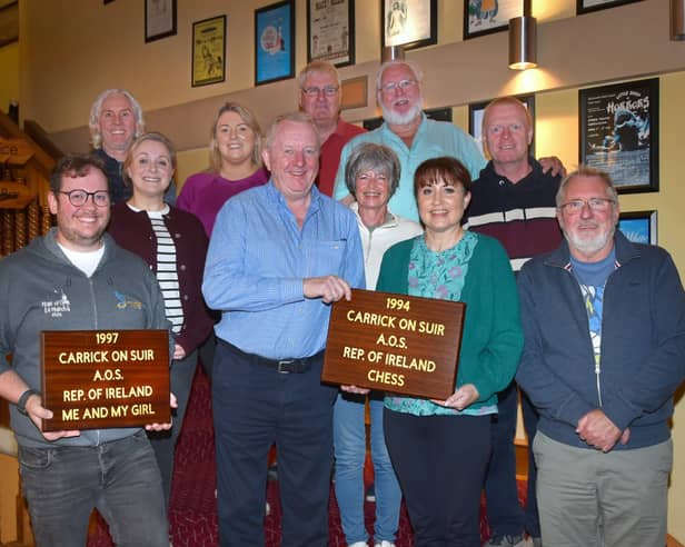 Former owner of The Munster Bar in Waterford Peter Fitzgerald (centre in blue shirt) presenting the plaques. From left: Caolán Deehy-Power, Louise Russell, Ray Nolan, Siobhán Grace-Regan, Peter Fitzgerald, Breda Butler, Michael O'Hara, Liam Butler, Sandra Power, Martin Morrissey, Padraig Sheehan