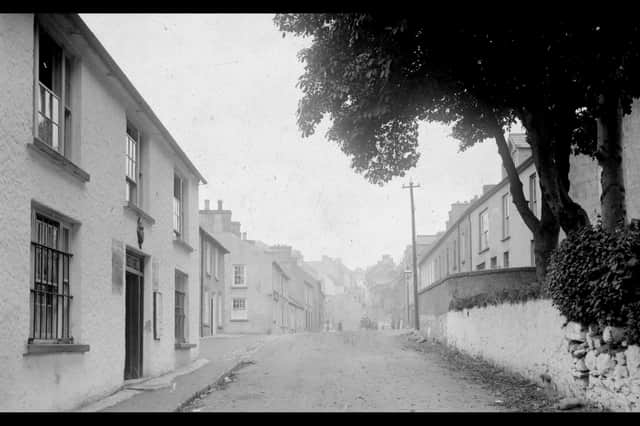 A photo of Main Street, Milford, with old RIC Barracks on the left, c.1908-1912. Courtesy of the Donegal County Museum, McCausland Collection