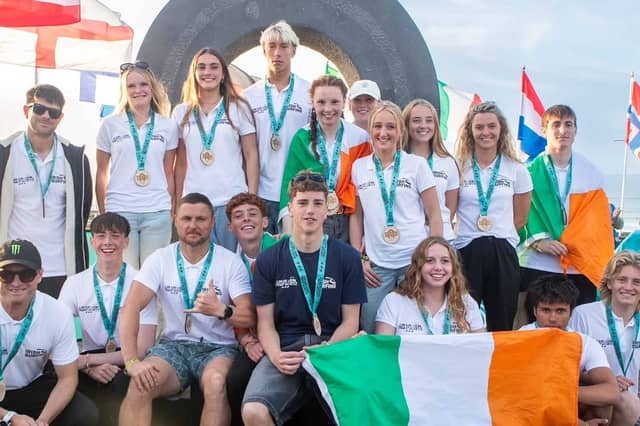 Irish Junior Surfing Team in Bundoran, with Isabella O'Reilly in the centre with Irish flag